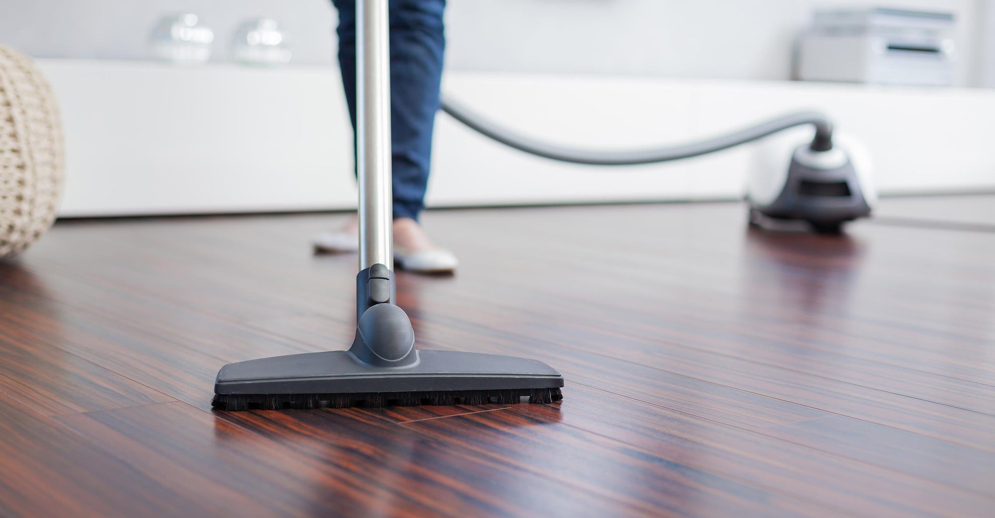 Vacuuming a wooden floor