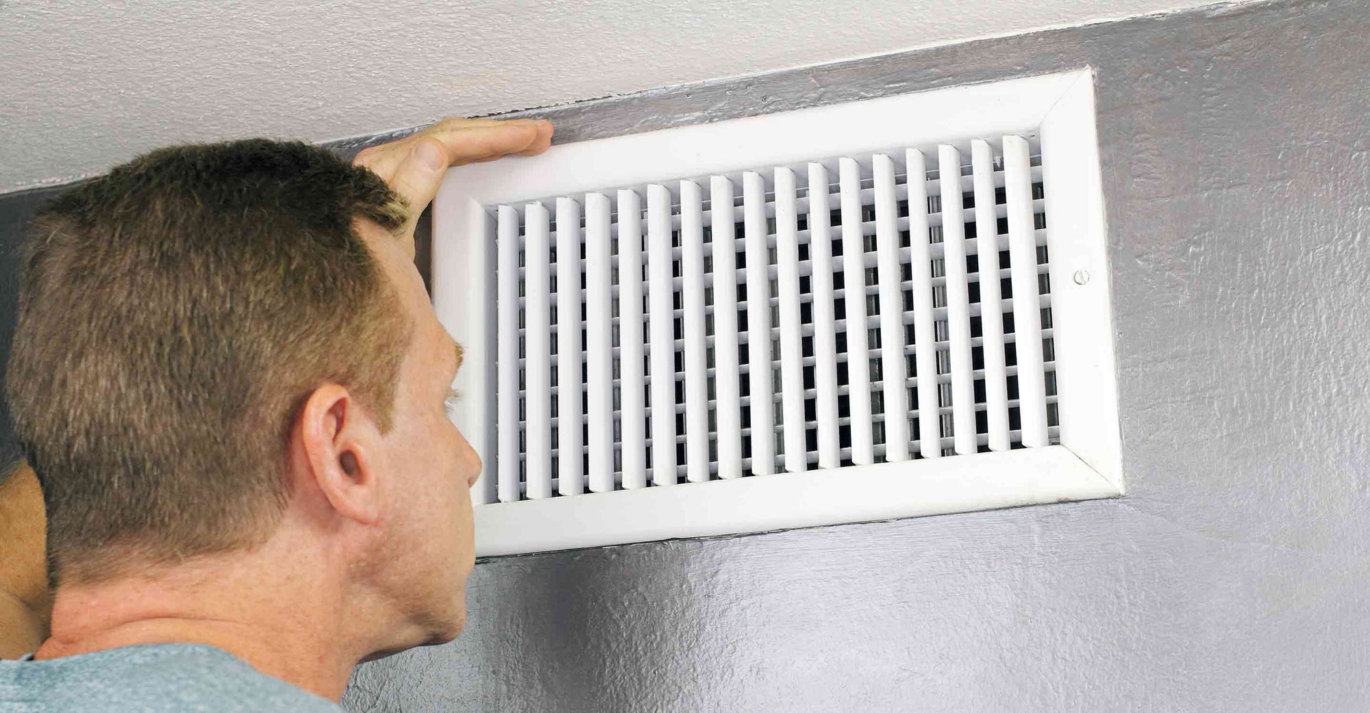 Man checking his air duct