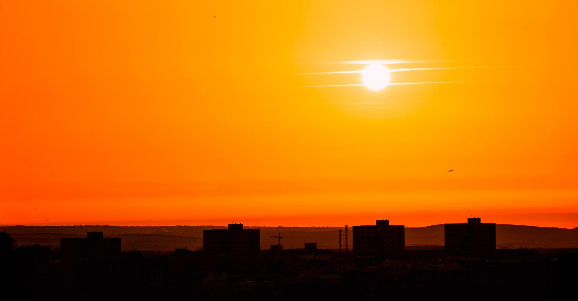 Orange skies over several buildings