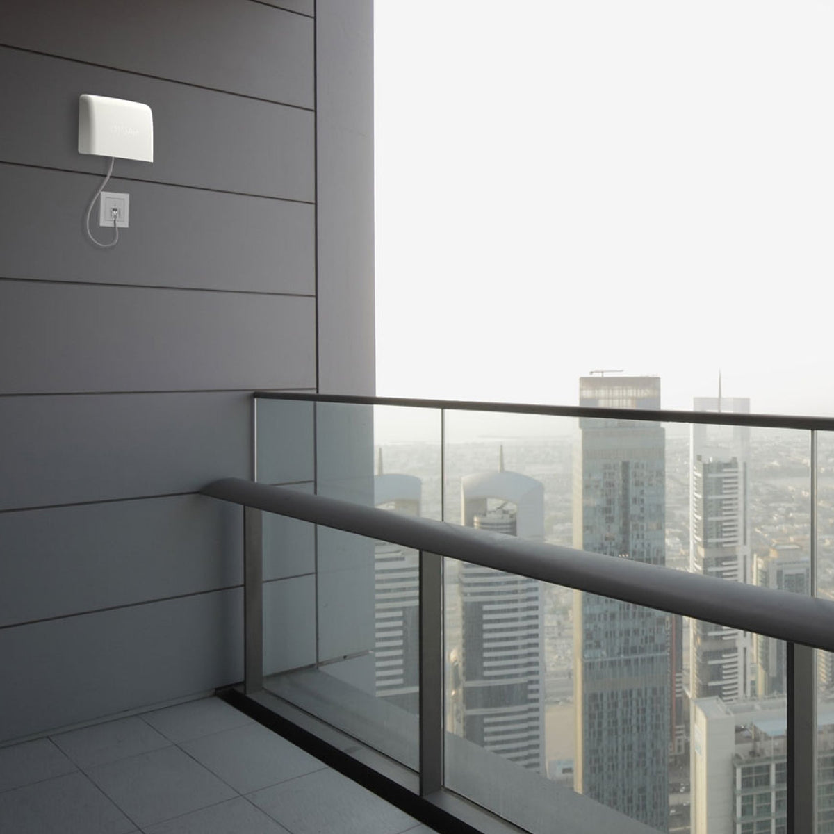 AirVisual Outdoor mounted on side of high rise apartment